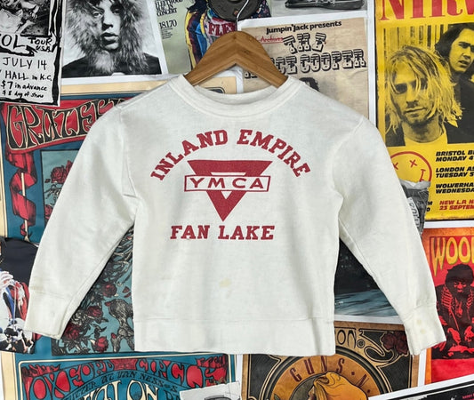 Cool vintage kids 50s white and red Inland Empire YMCA Fan Lake Spokane Washington Camp Reed long sleeve graphic pullover crewneck sweatshirt top. Has some light staining through out and a tiny pinhole from where a tag was. There is no label or tag size. We estimate it to fit kids size 5 ages 4-5. Please check measurements as this is an estimate.
