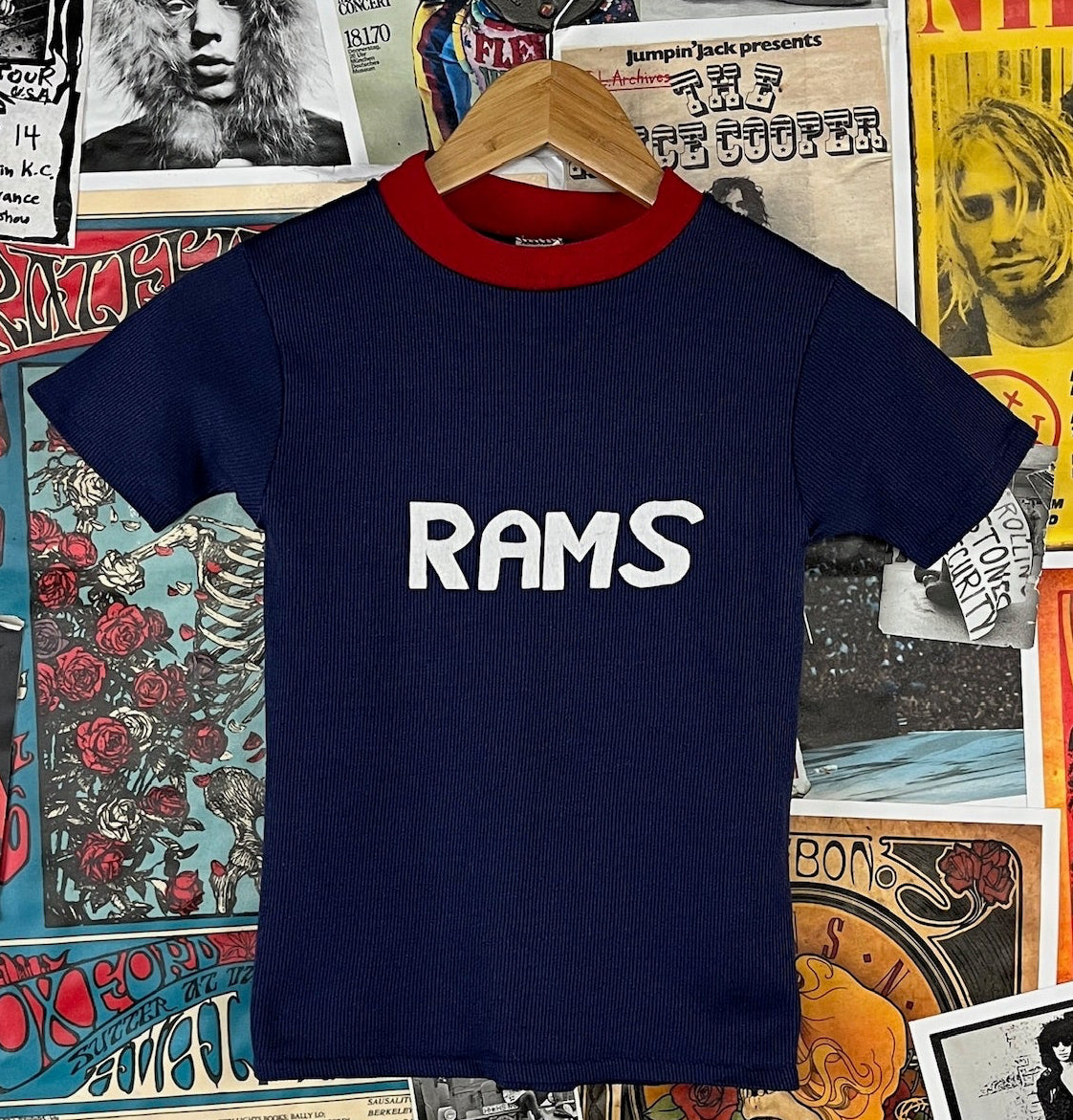 Boys navy blue Sears 80s retro t-shirt with a red collar and 'RAMS' printed in white across the chest. Size 8 ages 7-8.