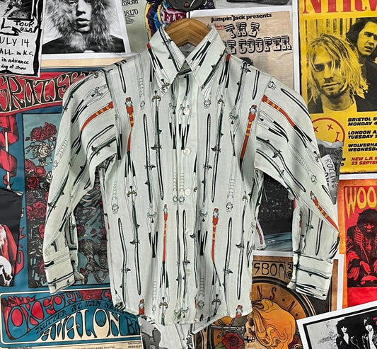 Funky vintage boys kids retro 70s cyclist bicycles novelty print long sleeve collared button up disco shirt by Wrangler. Tagged boys size 8, which we estimate to fit ages 7-8. Made of 50% polyester and 50% cotton in the USA. Has a coupe of small spots, but is in otherwise good pre-owned condition.