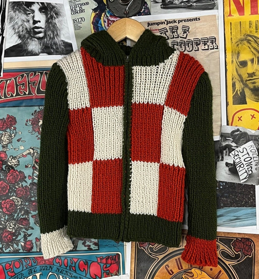 Vintage kids boys girls retro 1960s-70s green, orange, and white check color block print long sleeve knit hooded zip up cardigan sweater. Feels like an acrylic and is in good pre-owned condition. Features a Conmar zipper and appears to be handmade. There is no label or tag size. We estimate it to fit kids size 5, ages 4-5.