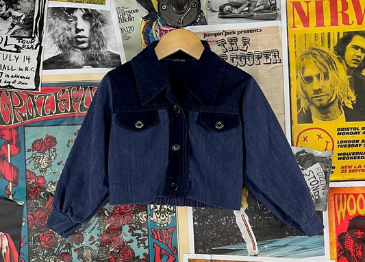 Cool vintage kids retro 1970s navy blue two tone denim and velvet long sleeve collared cropped button up shirt jacket shacket. Features faux chest pockets and an elastic waist band. There is no label or tag size intact. We estimate it to fit toddler size 4T. Is in good, pre-owned condition. Is technically a girls, but could be worn unisex.
