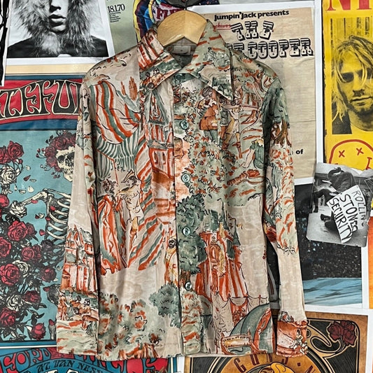 Awesome vintage boys kids retro 1970s multi-color Robin Hood merry men Sherwood Forest all over novelty print long sleeve collared button up disco shirt. Tagged a boys size 8, but we estimate it to best fit size 7 ages 6-7. Part of the front hem was re-sewn, has some thin spots on the sleeve, there is a small hole on the upper back near the collar, and the shirt has some overall wear thinning through out.