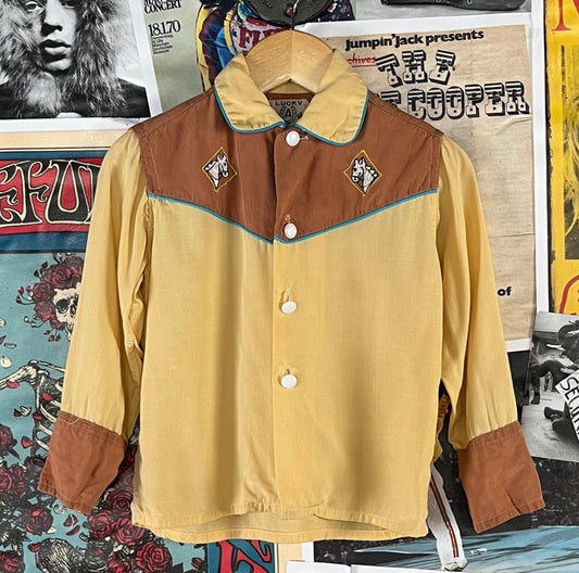 Awesome vintage toddler boys kids retro 1950s yellow, brown, white, and blue long sleeve collared rockabilly Western button up shirt with embroidered horse emblems by Lucky A Aristo Togs. Feels like rayon, but there is no fabric tag intact. 